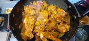 adding necessary ingredients to peanut chicken
