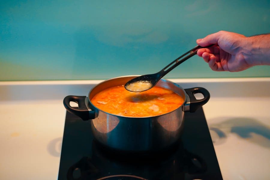 cooking on induction Cooktop in kitchen