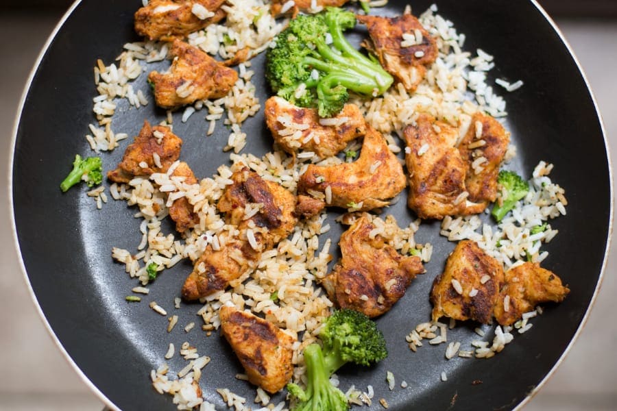 cooking rice, chicken with vegetables on hard anodized cookware
