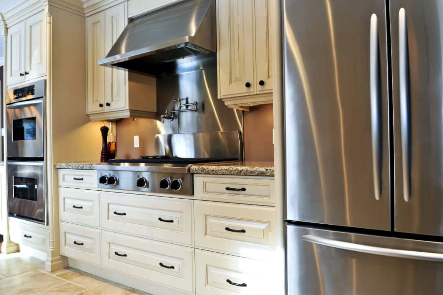 hide chimney pipe behind kitchen cabinet