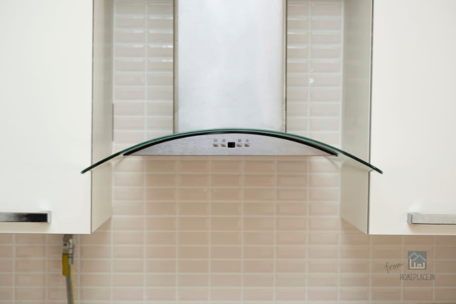 Curved Glass Chimney in modular kitchen